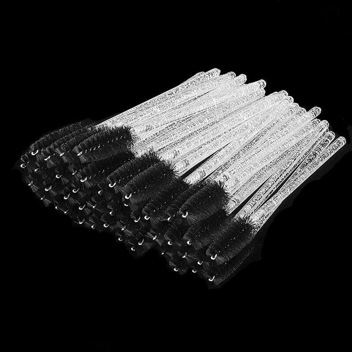 Eyelash mascara brushes with clear glitter handles and black bristles, perfect for classic and volume lash extensions.