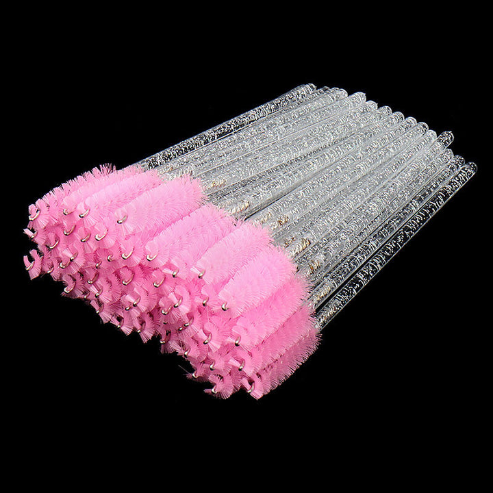 Pink mascara brush with glitter handle for eyelash extensions, fluffy bristles for volume lashes.