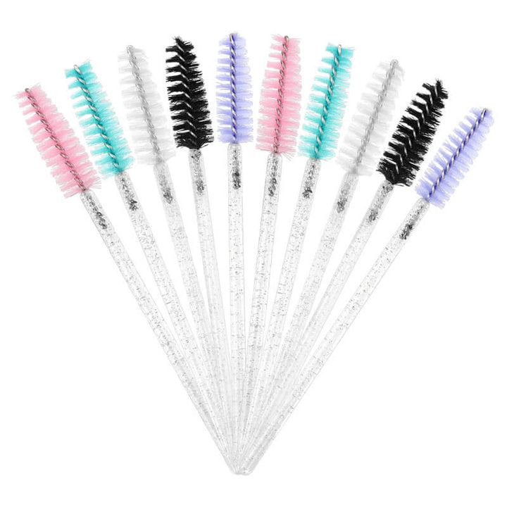 Glitter eyelash mascara brushes, various colors for eyelash extensions. Pink, green, white, black, and purple bristles.