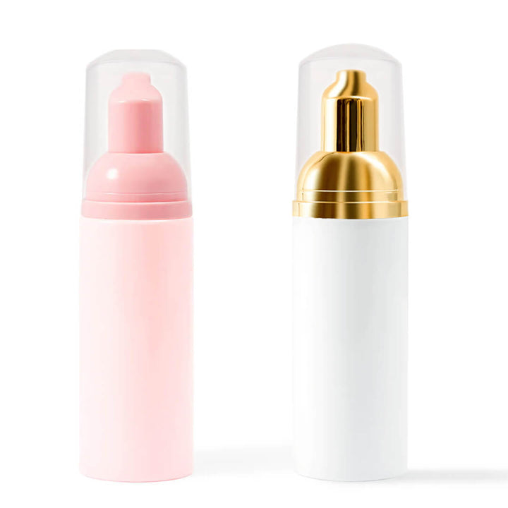 Eyelash extension cleanser foam bottles in pink and white, essential for lash care and long-lasting lash extensions.
