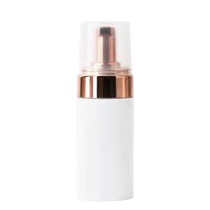Eyelash shampoo foam cleanser bottle with white body and rose gold accents, essential for lash extension care.