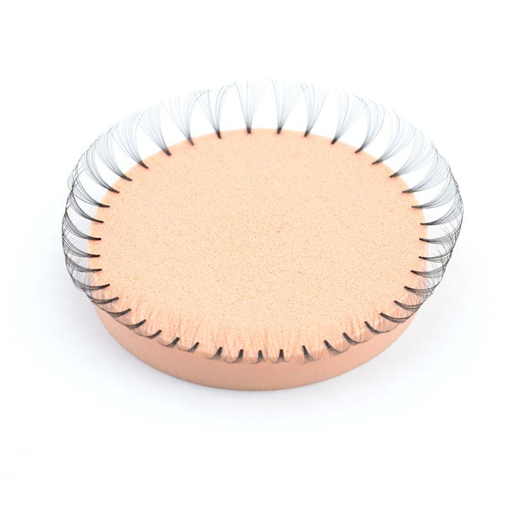 Peach sponge with volume lash fans for easy lash extension arrangement. Professional lash tool for stylists.