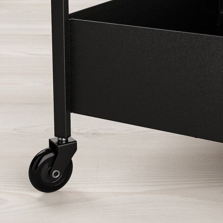 Black rolling cart wheel detail for lash supplies storage 