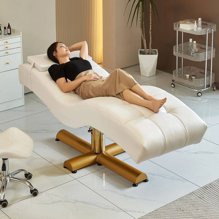 Woman relaxing on Curved Lash Beauty Bed in Salon