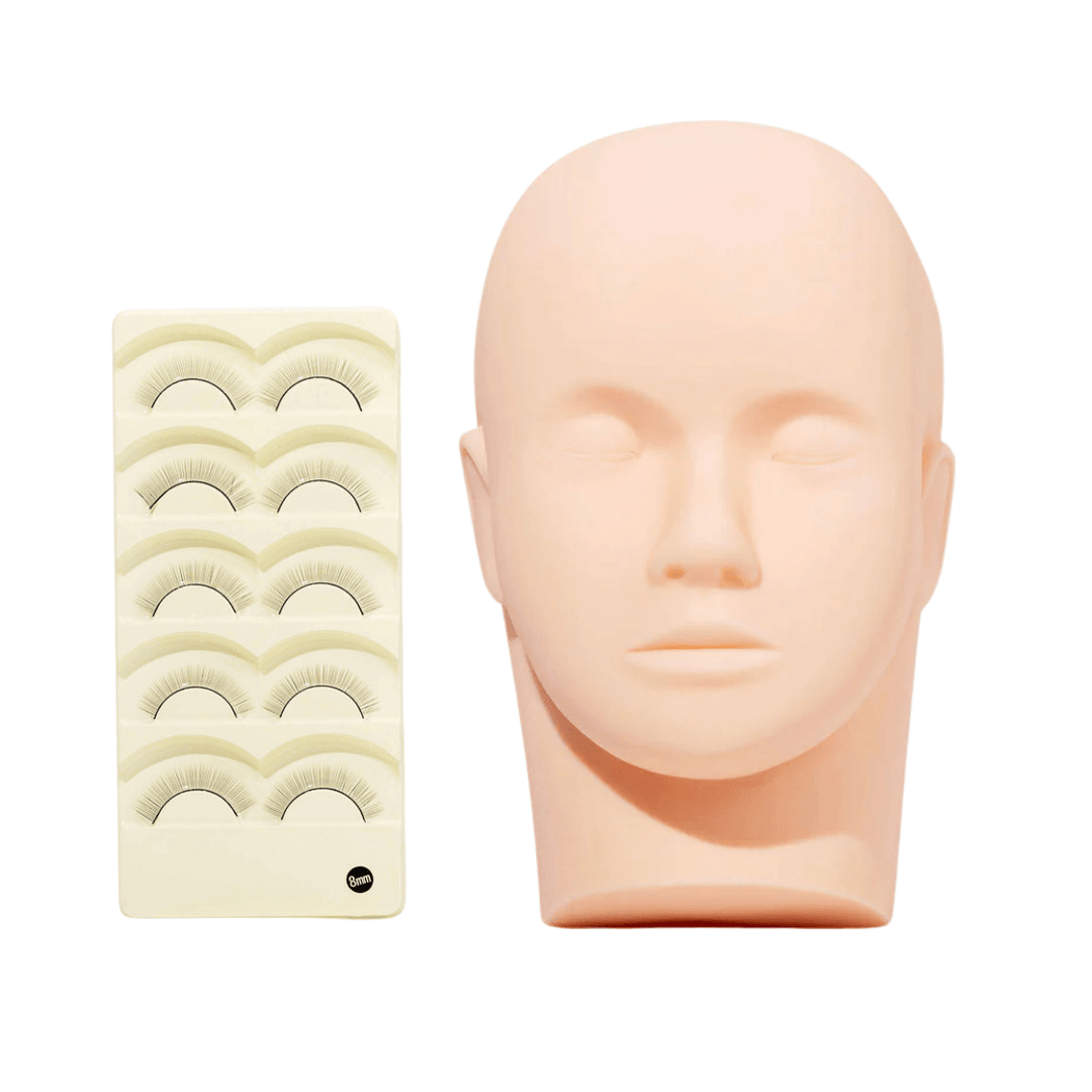 Mannequin head for practicing eyelash extensions with lash strips.