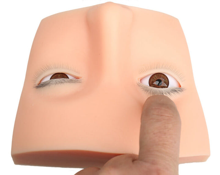 Soft silicone mannequin head for eyelash extension training, with realistic eyelashes.