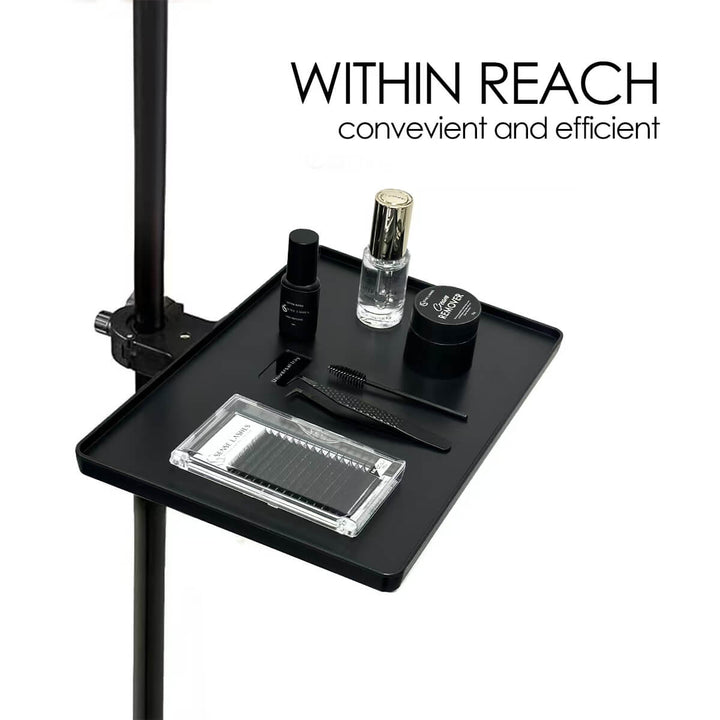Eyelash extension application tool tray with supplies, within reach.