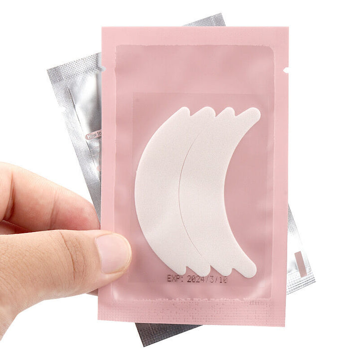 Butterfly shaped foam eyepads in pink packaging, soft and gentle for eyelash extensions
