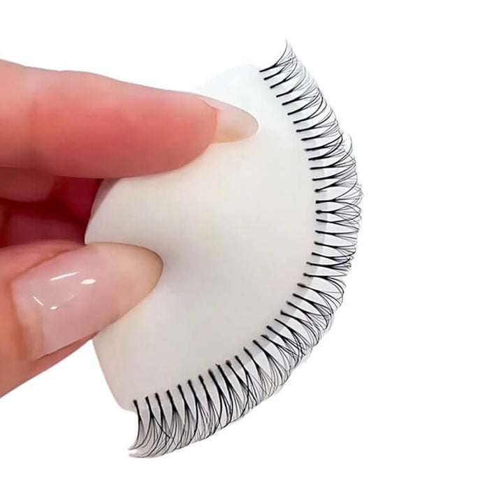 Eyelash extension training sponge with applied lashes