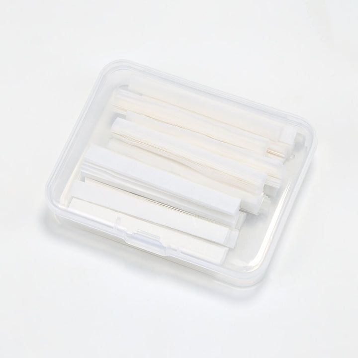 Clear plastic box of white lash lift paper compensator strips