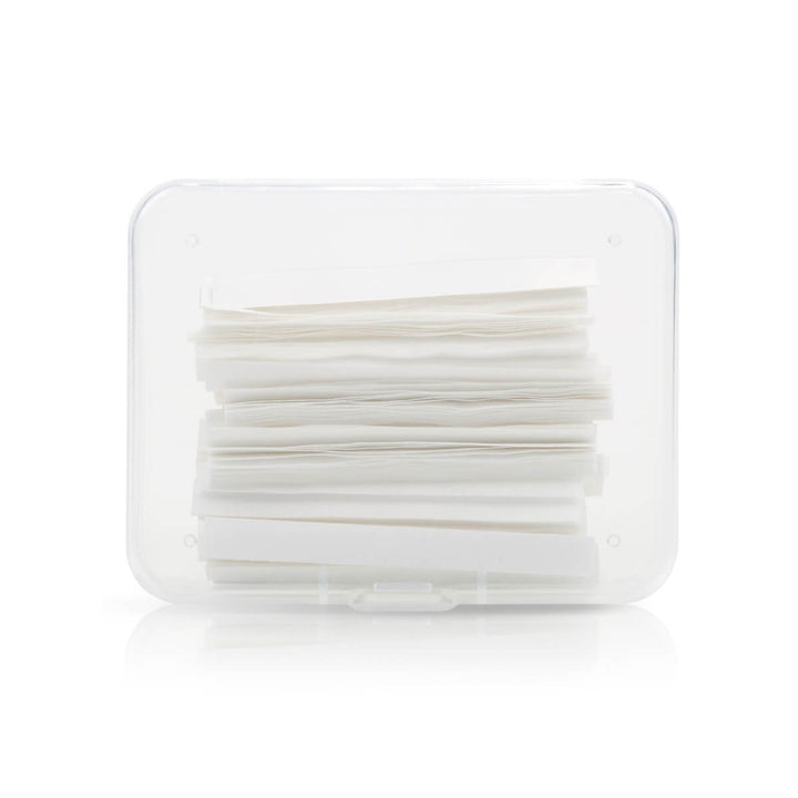 White lash lift paper compensator strips in clear plastic case