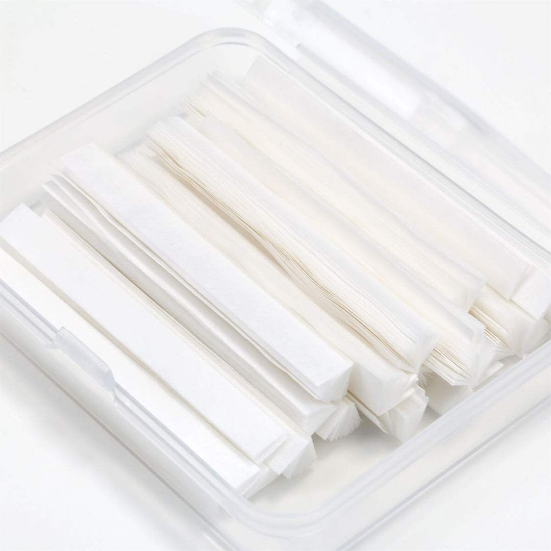 White lash lift paper compensators in a clear storage box