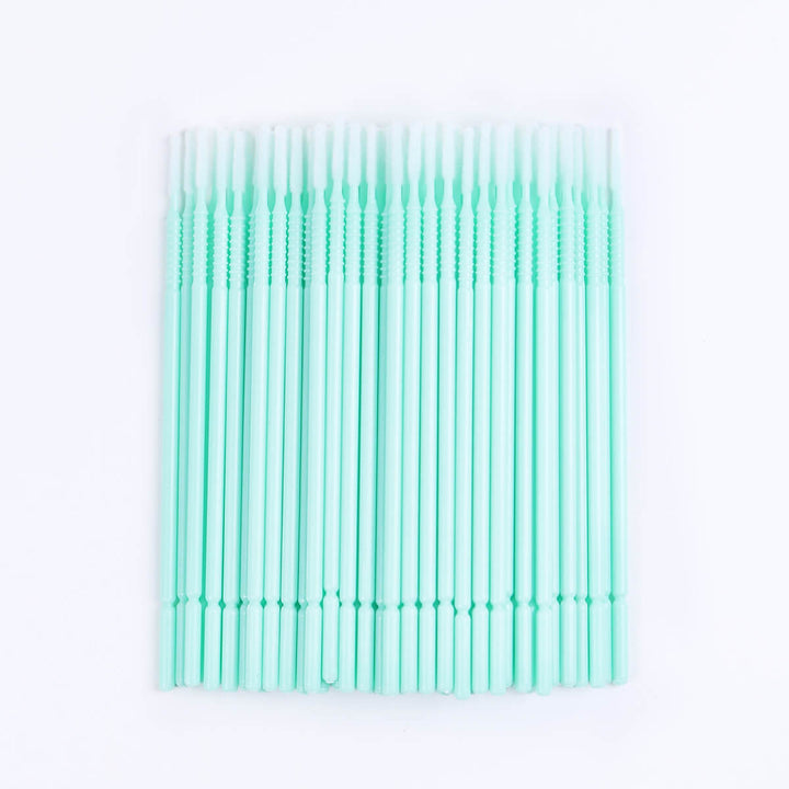 Micro brush swabs for eyelash extensions, clear tube, blue base. Lash primer and remover applicator.