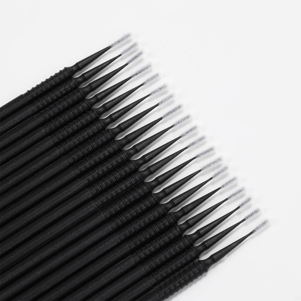 Black eyelash extension applicator brushes with fine tips for precise lash application