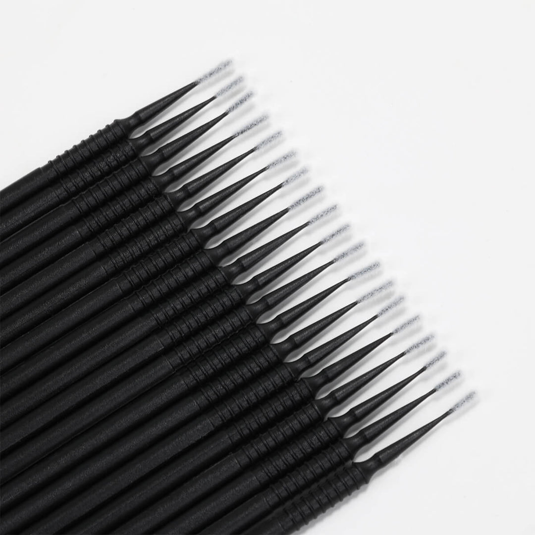 Black eyelash extension applicator brushes with fine tips for precise lash application