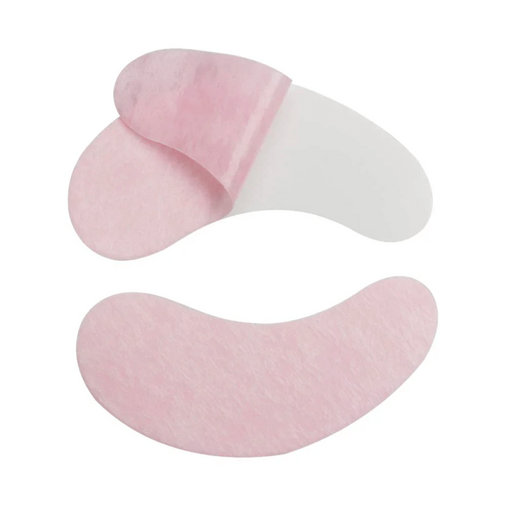 Pink and white collagen eye gel pads for eyelash extensions, moisturizing and brightening under-eye area, lint free material.